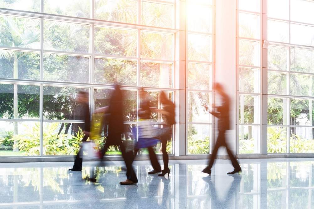 Group of business people rushing in the lobby